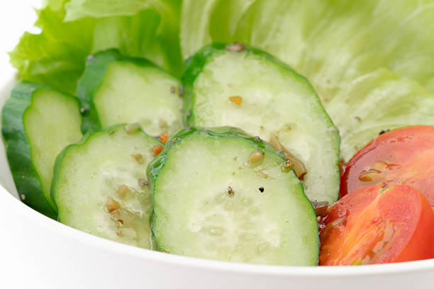 Thinly sliced cucumbers ready for a quick vinegar pickle