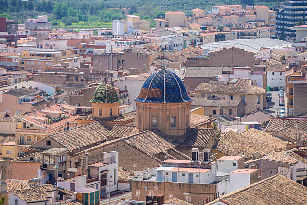 Aerial view of the historic town of Segorbe in Castellón Province, Spain, with its iconic tiled domes and traditional Mediterranean rooftops.