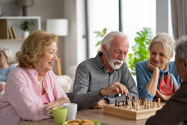 istock Seniors Playing Chess in a Social and Friendly Setting 2212586887