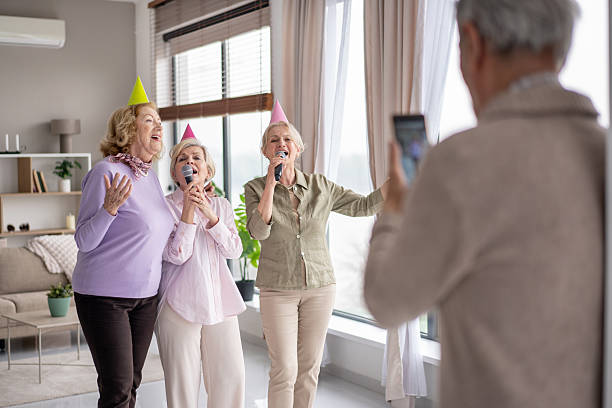Three friends singing happily during a delightful party.