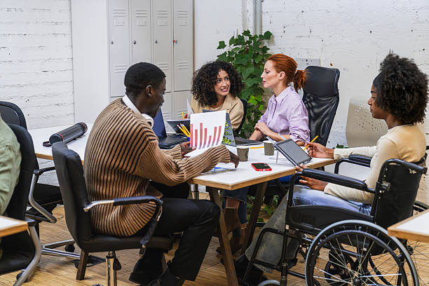 istock Multiethnic youth group collaborating in a coworking space 2212587946