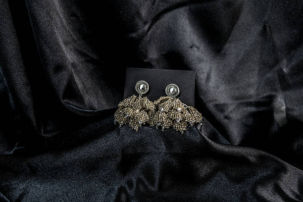 istock Elegant Beaded Statement Earrings on Black Satin 2212588862