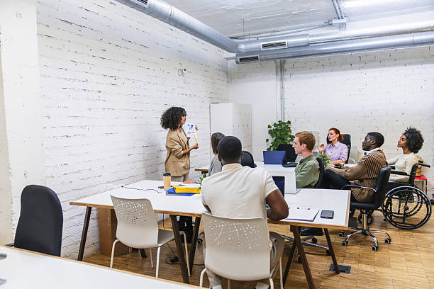 istock Young multiethnic team following a business presentation in coworking space 2212588971