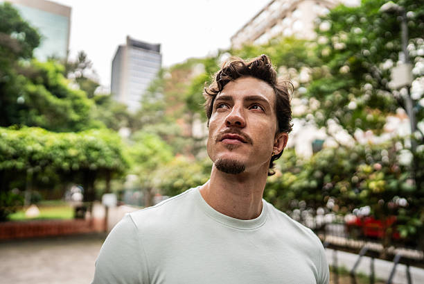 istock Young man contemplating at public park 2212589674