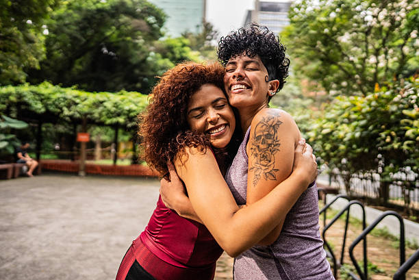 istock Friends women embraced on public park 2212589686