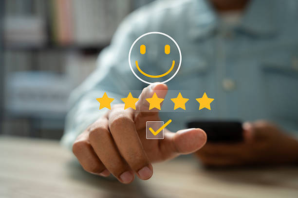 istock Happy customer providing 5-star review via mobile application after receiving outstanding service and quality product. Online customer feedback plays crucial role in business ranking, Consumer trust 2212590835