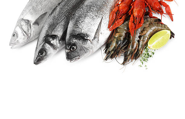 istock Sea food with lemon and thyme isolated on white, top view 2212591078