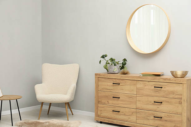 istock Round mirror on light grey wall in room. Interior design 2212591461