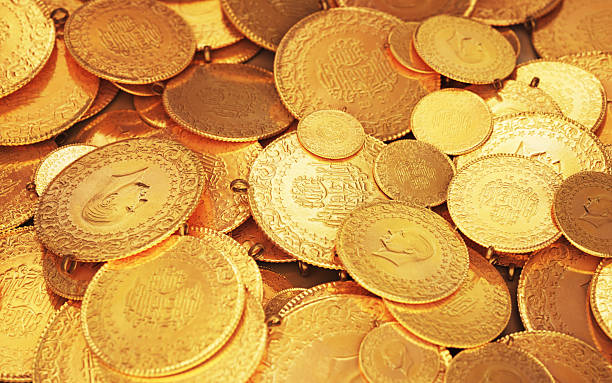 istock Turkish Jewelry Gold Coin Stack on Glass Counter 2212592269