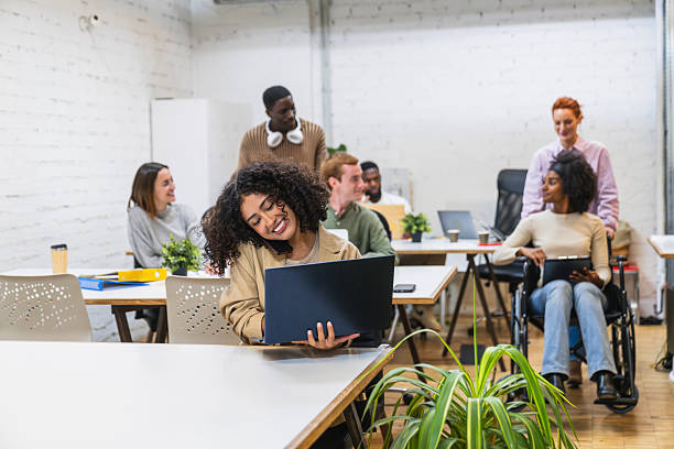 istock Young multiethnic businesspeople working in a modern coworking space 2212592816