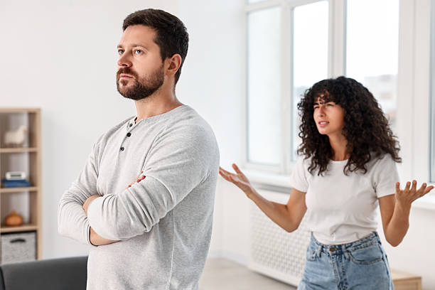 istock Emotional couple having quarrel at home, selective focus. Relationship problems 2212593033