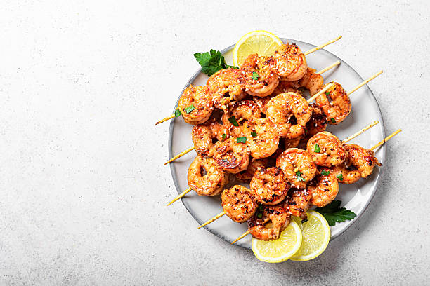 istock Grilled shrimps skewers 2212593957