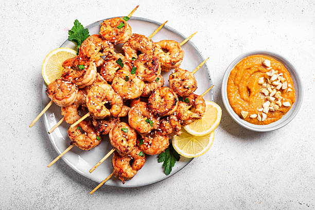 istock Grilled shimp prawn satay with spicy peanut sauce 2212593980