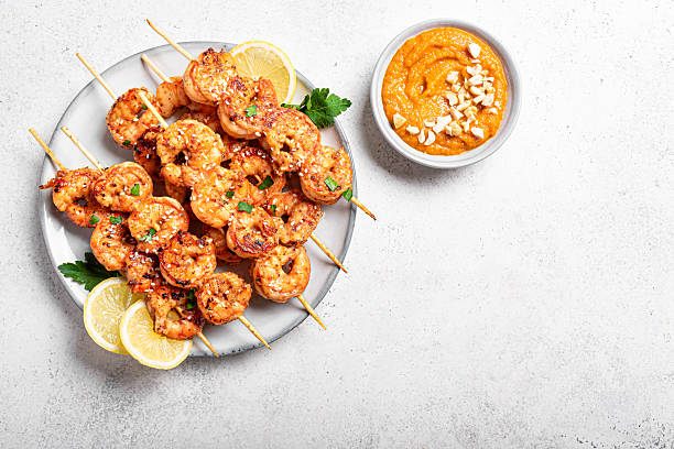 istock Grilled shimp prawn satay with spicy peanut sauce 2212593994