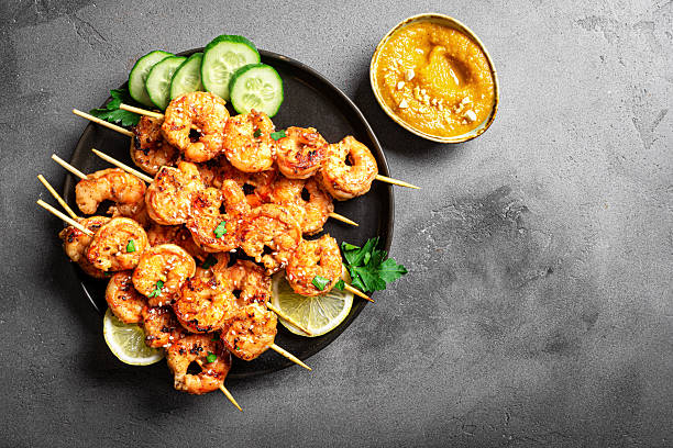 istock Grilled shimp prawn satay skewers with peanut sauce 2212594041