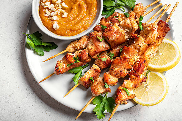 istock Chicken satay skewers with spicy peanut sauce 2212594316