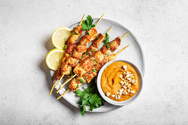 istock Grilled chicken satay with spicy peanut sauce 2212594320