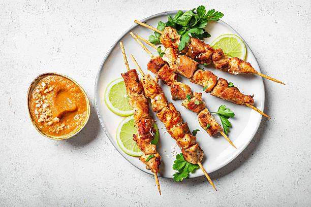 istock Malaysian chicken satay skewers with peanut sauce 2212594327