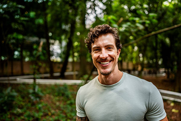 istock Portrait of young man on public park 2212594355