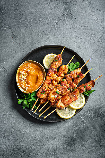 istock Grilled chicken satay with spicy peanut sauce 2212594480