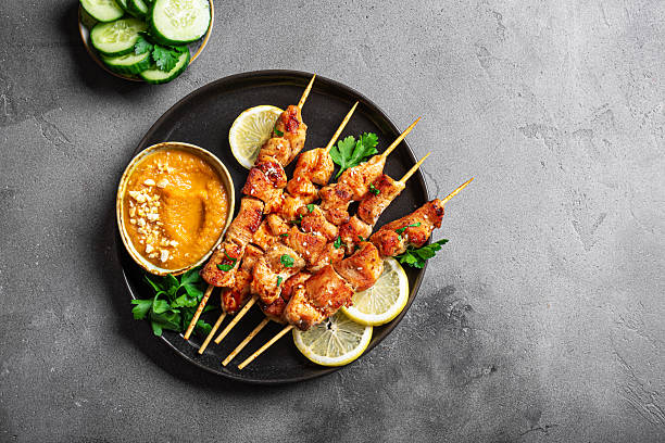 istock Grilled chicken satay with spicy peanut sauce 2212595034