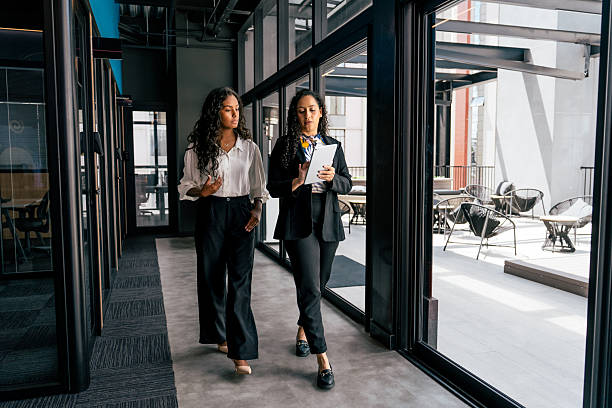 istock Two women talking in the office 2212595948