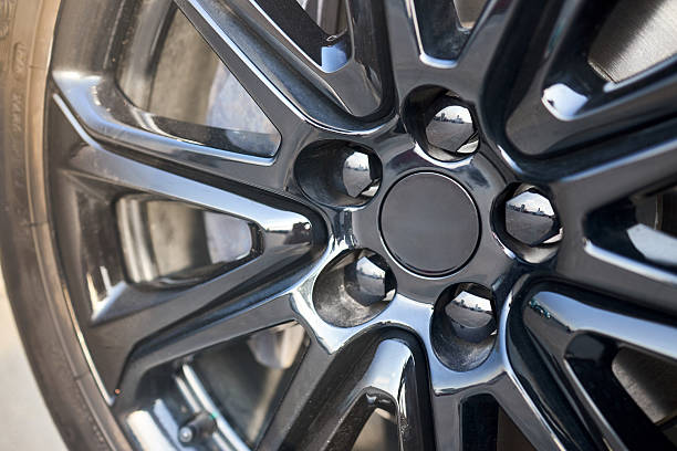 istock Alloy wheel plug and brake caliper selective focus close up. 2212595971