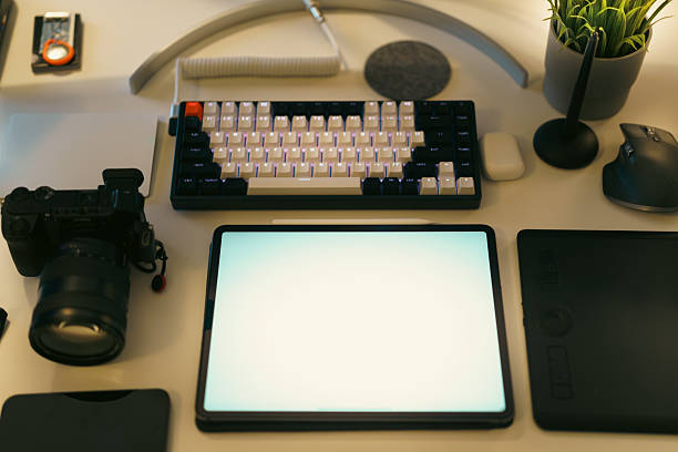 graphic designer photographer desk workplace graphic tabler screen mockup computer keyboard camera devices from abowe green plants graphic tablet creative freelance work