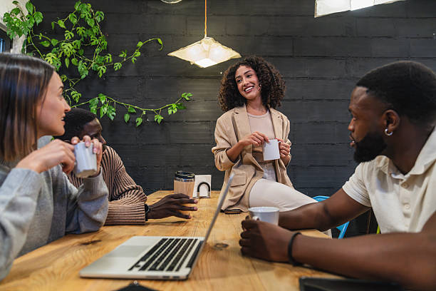 istock Young multiethnic coworkers taking a break in modern office 2212597291