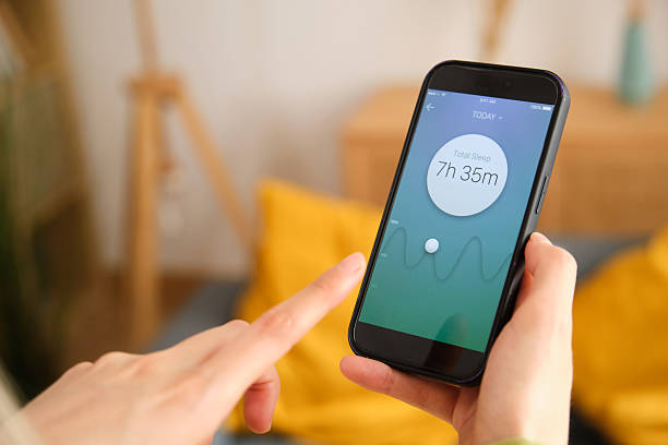 istock Woman checking her sleep data on a mobile phone app 2212600867