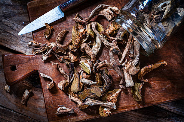 Dried mushrooms (Boletus edulis) shot from above on cutting board