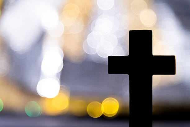 istock Backgrounds of religious cross and defocused lights 2212602174