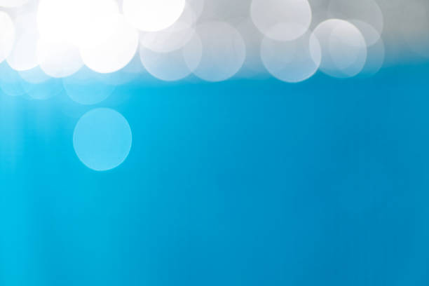 Defocused Christmas blue lights background.
