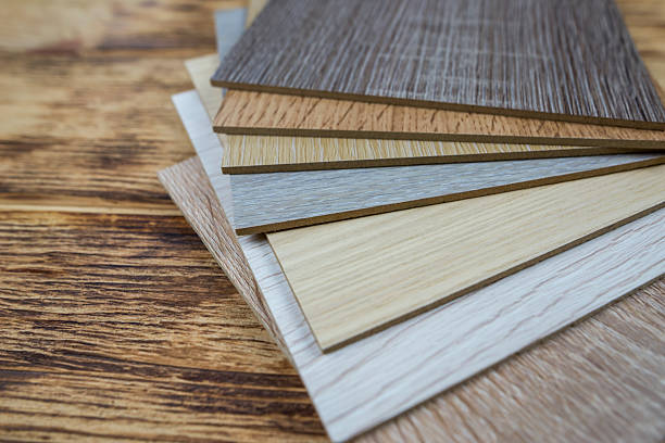 istock wooden premium sampler for design of modern apartments.Laminate background. Samples of laminate or parquet with a pattern and wood texture for flooring and interior design. Production of wooden floors 2212603475