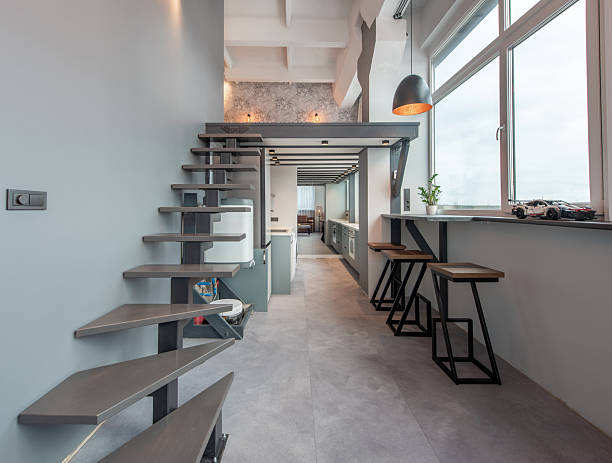 istock Modern Loft Apartment Kitchen with Staircase and Minimalist Design 2212604759