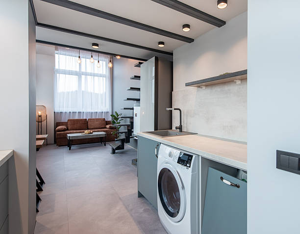 istock Modern Loft Apartment Interior With Living Area and Stylish Functional Kitchen 2212604772