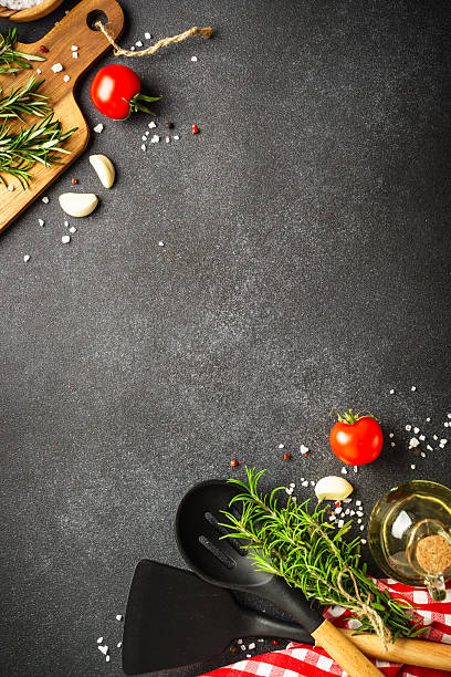 istock Food background with herbs, spices and utensils on black. 2212604799
