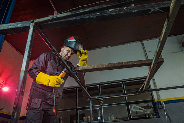 istock Metal worker welding metal frame 2212605033