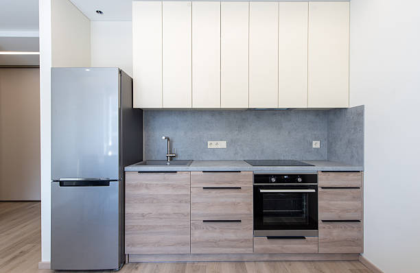 istock Contemporary Kitchen Interior with Modern Appliances and Wooden Cabinets 2212605075