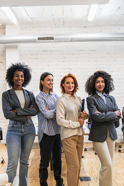 istock Multiethnic businesswomen team posing in coworking space 2212607814