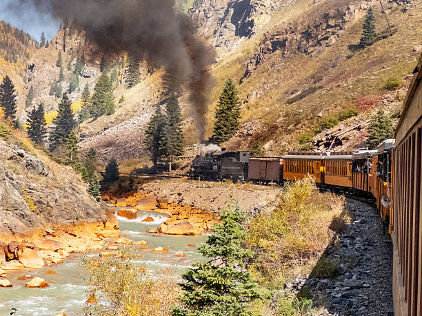 Durango, CO - October 7, 2023: The historic Silverton-Durange Railroad steam train winding along Animas Creek in the San Juan mountains of Colorado