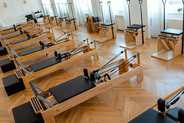 istock Modern Pilates Studio Interior with Reformer Machines 2212613654
