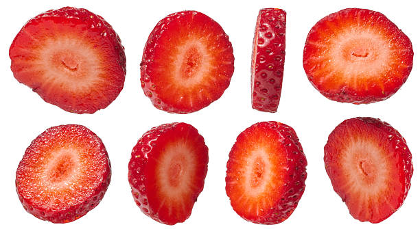 Set vibrant red strawberry slices, showcasing different angles and thicknesses, isolated background. The juicy interior and tiny yellow seeds