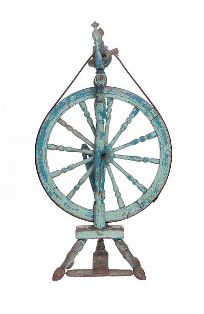 istock old wooden spinning wheel isolated on white background 2212615839