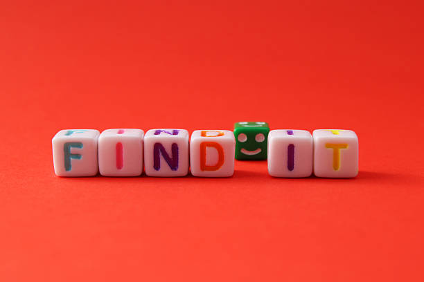 istock Cube with a happy face next to the phrase FIND IT 2212619786