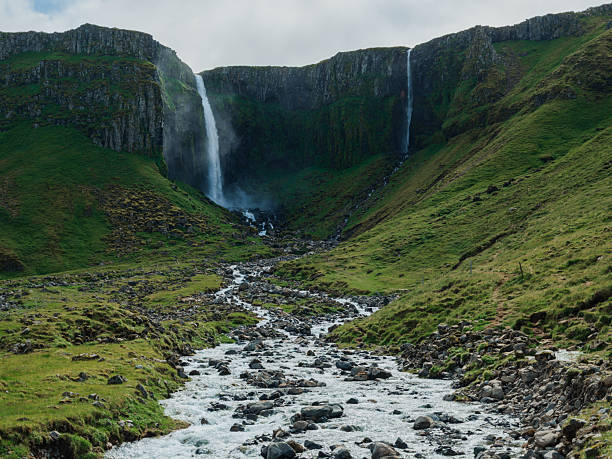 Scenic awe-inspiring  view of secluded  waterfall in Iceland