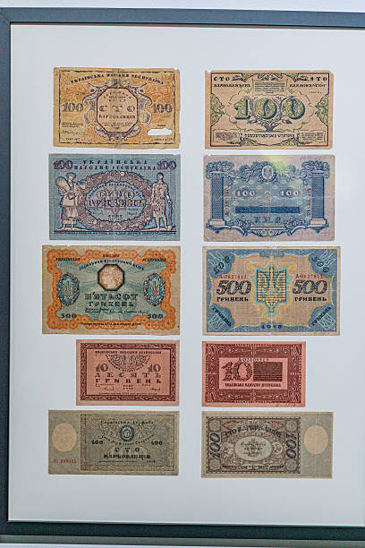 istock Historical, aged Ukrainian banknote pasted on a surface Features a portrait and intricate patterns in blues, greens, purples, and yellows Shows both left and right sides with 3D effect under natura 2212622111