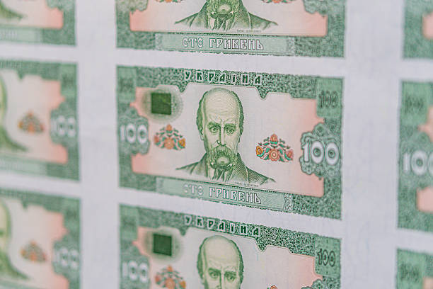 istock Close-up view of stacked currency notes, primarily Indian Rupees and one potential foreign note Neutral background Financial or economic context suggested Angled perspective 2212622871