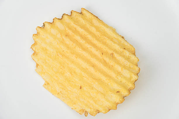 Bowl of black pepper potato chips sitting on a blue gingham pattern napkin