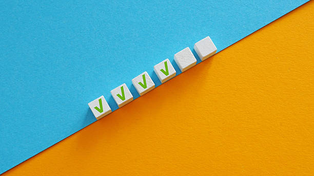 istock Cubes symbolizing completed parts of a plan or checklist. Task management. 2212623264